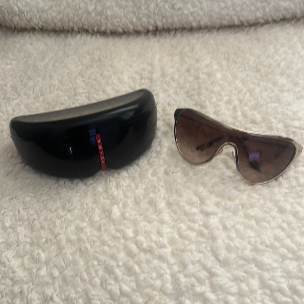Prada women’s gold sunglasses